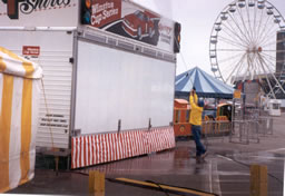 Signs and siding gets power washed at the New England Fair.