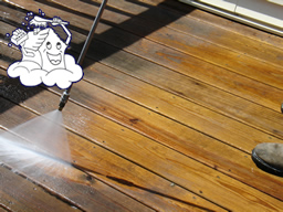 A weathered deck floor - before and after power washing.